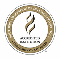 Circular logo of the Southern Association of Colleges and Schools with a flame motif and the words & Accredited Institution;.