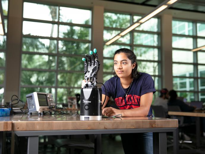 A student with a robotic hand