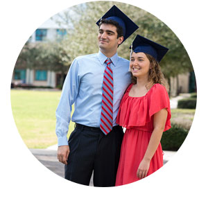 two students wearing mortarboard graduation hats